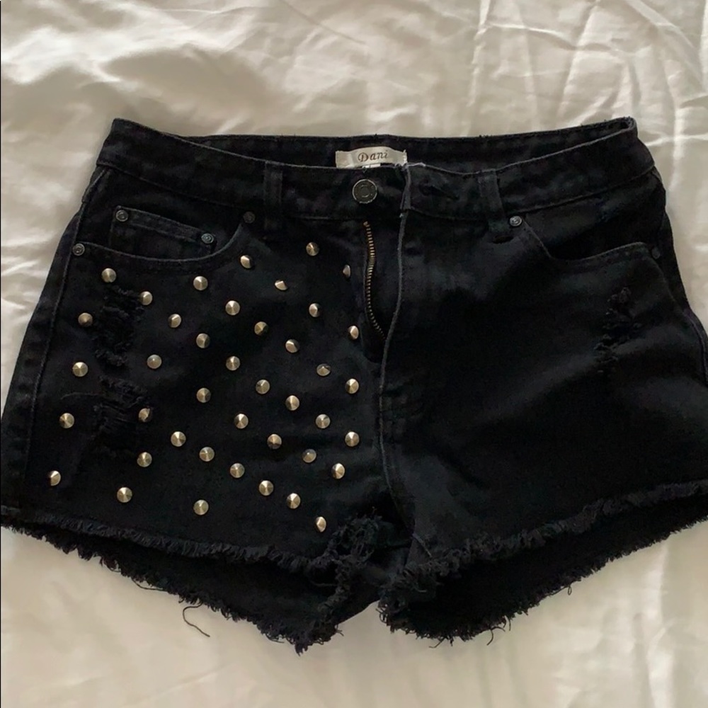 Adorable black shorts with round embellishments